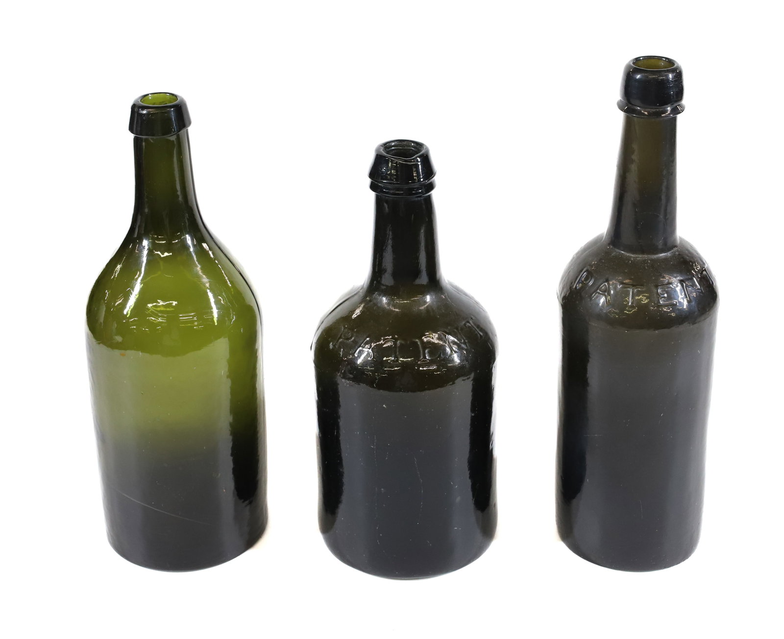 LOT OF 19TH C. BOTTLES: COMMERCIAL BOTTLES IN DEEP OLIVE GREEN. TALLEST MRKD. "PATENT" AT SHOULDER 10 7/8". MIDDLE SIZE "CARLSBAD, LS" AND SMALLEST MRKD. "PATENT" AT SHOULDER. PLEASE READ CAREFULLY - Terms for Purchasing and