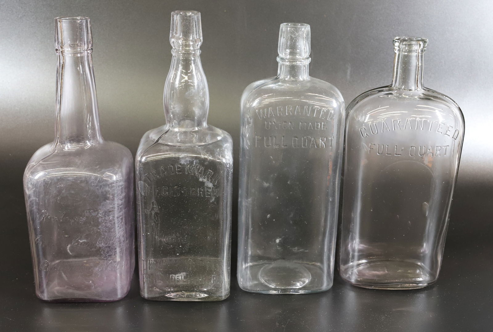 (4) ANTIQUE LIQUOR BOTTLES (1 of 5)