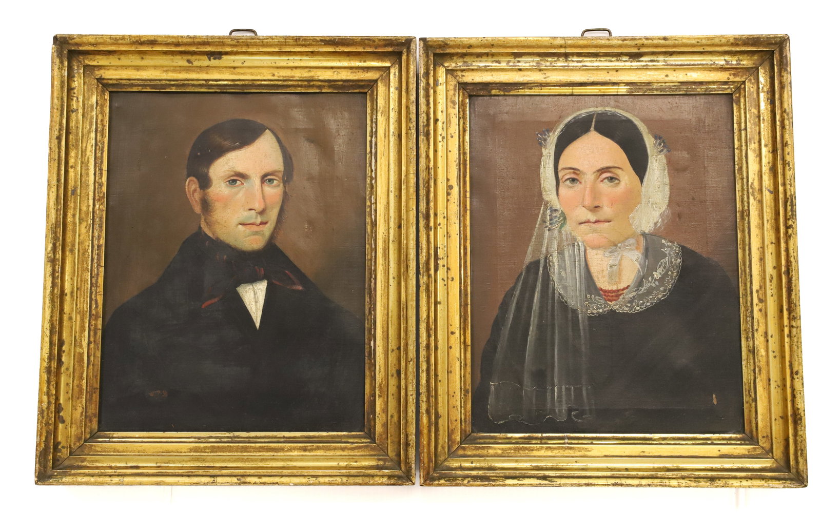 PAIR OF 19TH C. PORTRAITS: HUSBAND AND WIFE OIL ON CANVAS. MATCHING GILT FRAMES. UNSIGNED. 11 1/4" X 8 1/2" SIGHT VIEW. 14 1/2" X 12" TOTAL SIZE. PLEASE READ CAREFULLY - Terms for Purchasing and Shipping of Auction Items. Pleas