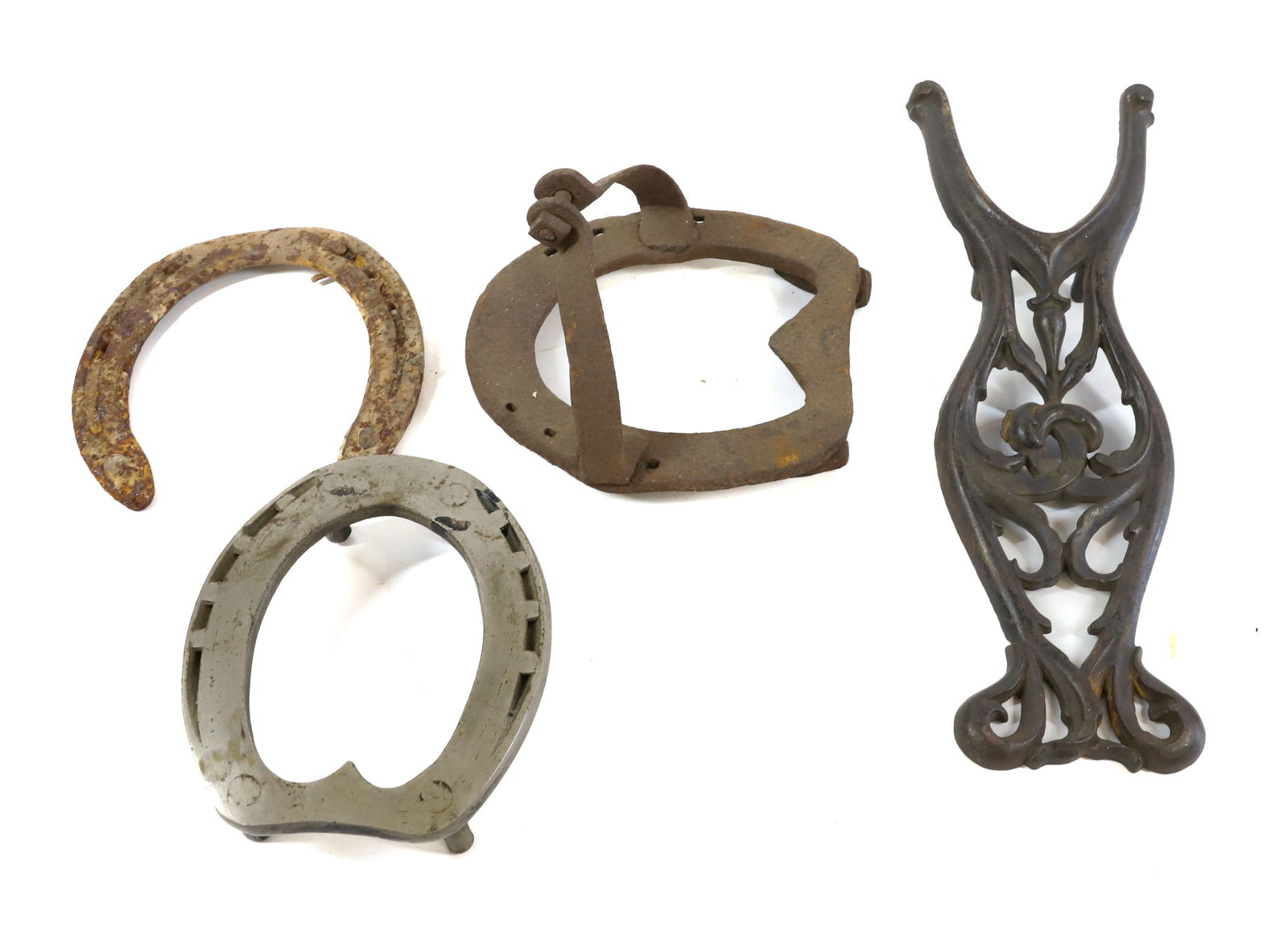 CAST IRON BOOT JACK AND HORSESHOES: ORNATE BOOTJACK 12" L., HORSESHOE TRIVET 5 3/4" L. AND MORE. PLEASE READ CAREFULLY - Terms for Purchasing and Shipping of Auction Items. Please read carefully before bidding. All payments for purchase