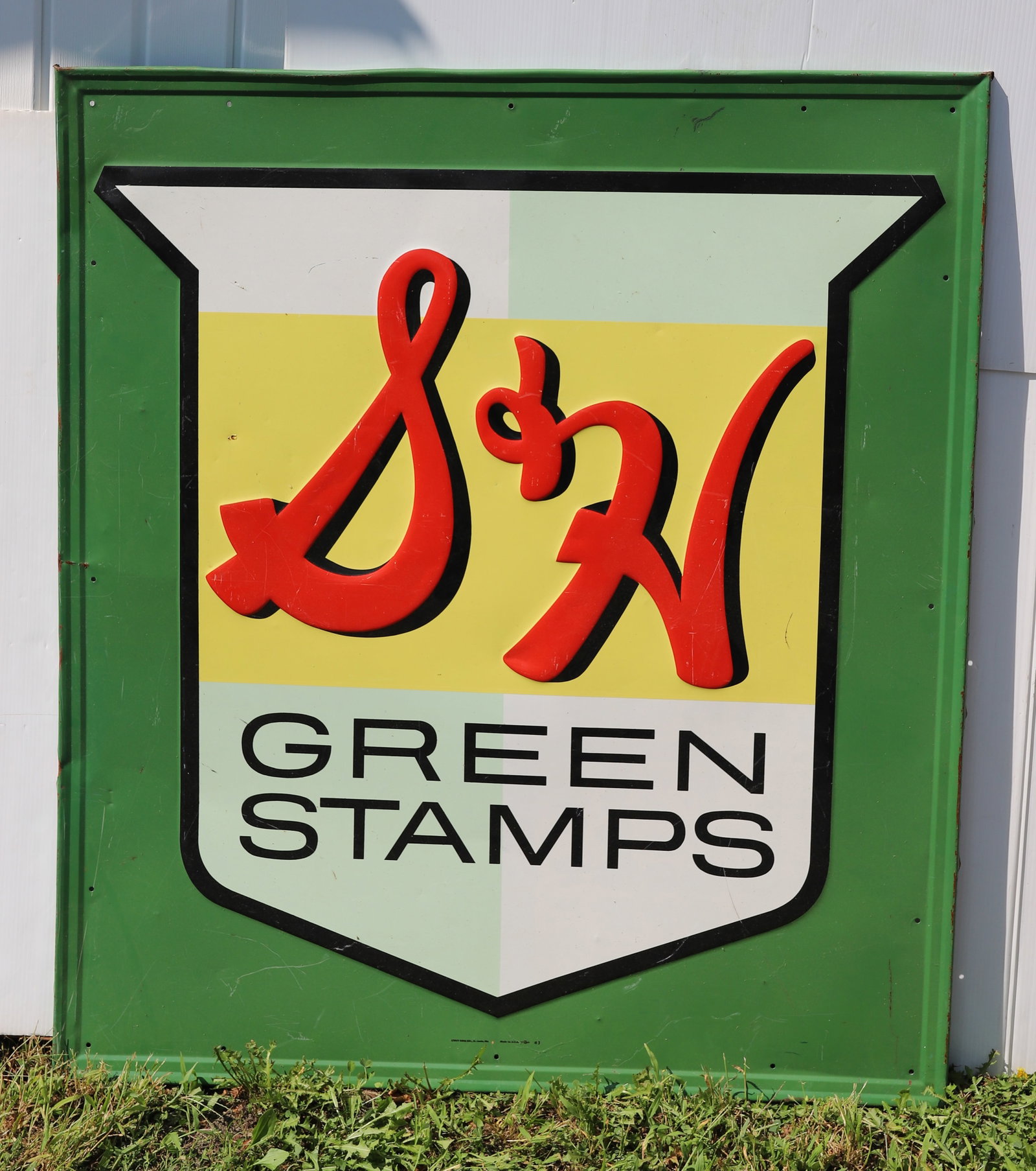 S & H GREEN STAMPS METAL SIGN: PAINTED EMBOSSED SIGN. 53" X 46 1/2". STOUT SIGN CO., ST. LOUIS, MO. #3. PLEASE READ CAREFULLY - Terms for Purchasing and Shipping of Auction Items. Please read carefully before bidding. All payments 