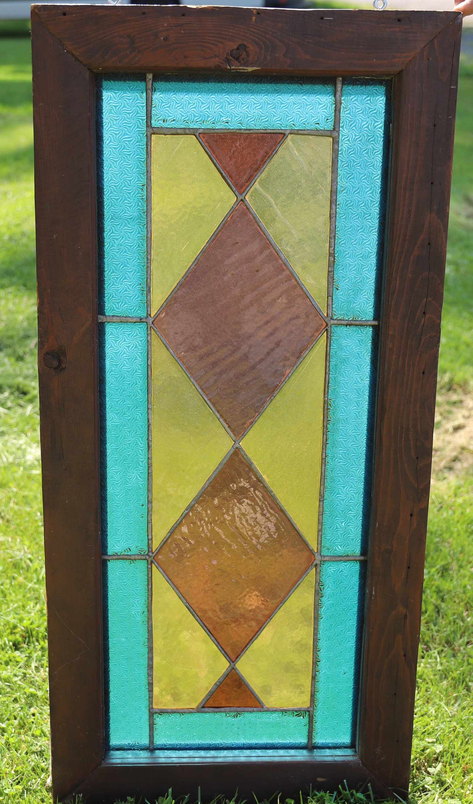 VINTAGE LEADED GLASS WINDOW: BLUE/YELLOW/LIGHT PURPLE GEOMETRIC. 33 1/2" X 16". PLEASE READ CAREFULLY - Terms for Purchasing and Shipping of Auction Items. Please read carefully before bidding. All payments for purchases will be 