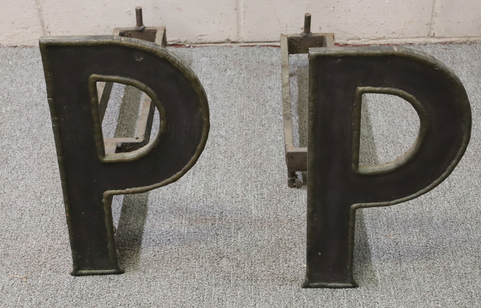 PAIR OF LETTER "P" ANDIRONS: 14 1/2" X 8" X 24" PLEASE READ CAREFULLY - Terms for Purchasing and Shipping of Auction Items. Please read carefully before bidding. All payments for purchases will be made through LiveAuctioneers.com