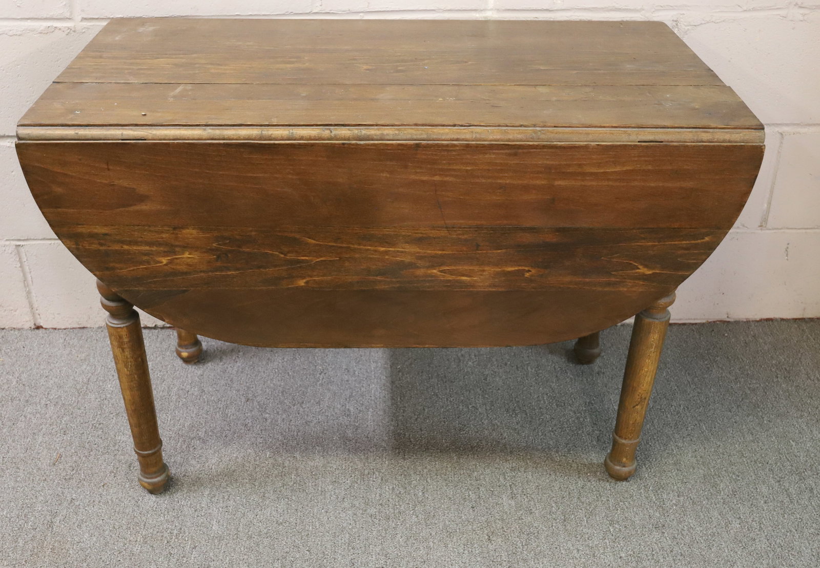 ANTIQUE DROP LEAF TABLE: OVAL SHAPED WITH TURNED LEGS, 24 1/2" X 42" X 36" (OPENED) PLEASE READ CAREFULLY - Terms for Purchasing and Shipping of Auction Items. Please read carefully before bidding. All payments for purchases