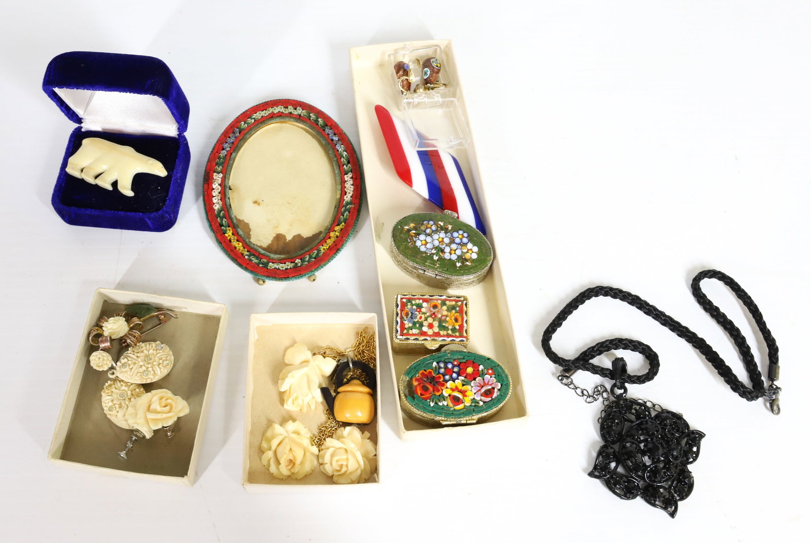 VINTAGE COSTUME JEWELRY: INCLUDES ITALIAN GLASS MOSAIC (3) PILL BOXES, OVAL PHOTO FRAME, ALASKA ESKIMO ARTISANS CARVED BONE POLAR BEAR, LUCITE RED, WHITE BLUE BROOCH, CARVED BONE ROSES NECKLACE, BROOCH, EARRING, BAKELITE TEAP