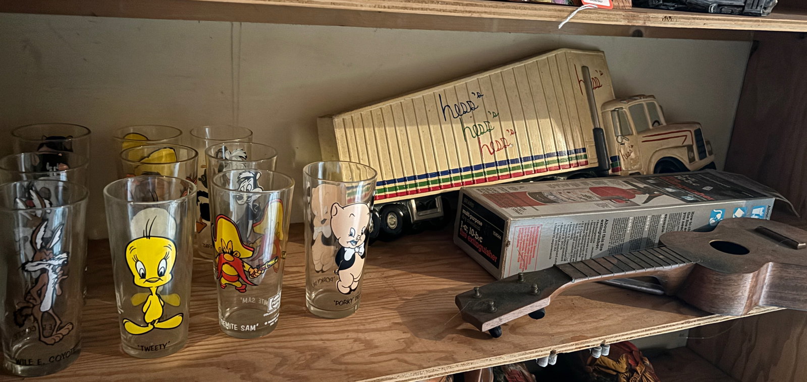 LOT OF CHARACTER GLASSES AND UKE: WOODEN UKE AND (10) CHARACTER GLASSES, WITH HESS WALL PLAQUE Terms: PLEASE READ CAREFULLY -THIS IS AN ONSITE AND ONLINE ONLY AUCTION. PICK UP WILL BE AT 5115 ANONA RD, STROUDSBURG, PA 18360 AND WILL O
