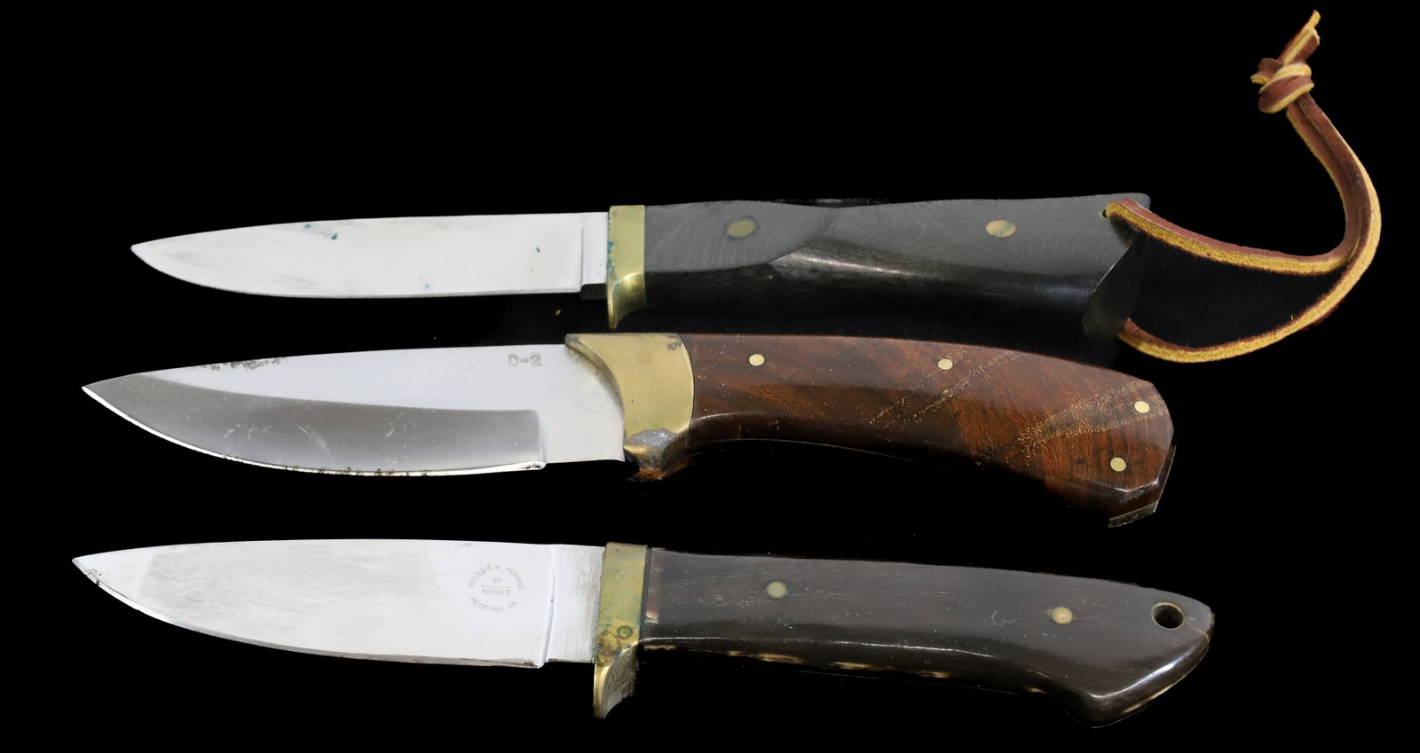 (3) CUSTOM HUNTING KNIVES: INCLUDING: ONE MRKD. BENCHMARK KNIVES, ONE MRKD. D-2 AND ONE MRKD. ROGER K. YOUNG, ROSEHILL, VA. BLADES 4" L. Registration: Terms: