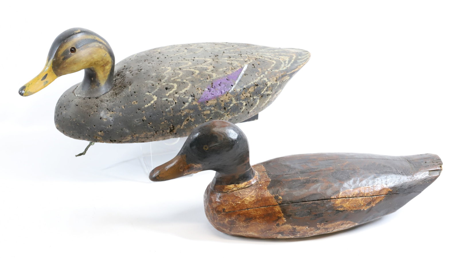 (2) DUCK DECOYS: INCLUDING: HAND CARVED DECOY WITH LEAD WEIGHT ON BOTTOM. CORK BODY MALLARD WITH PAINTED/CARVED WOODEN HEAD. 18 1/2" L. Registration: Terms: