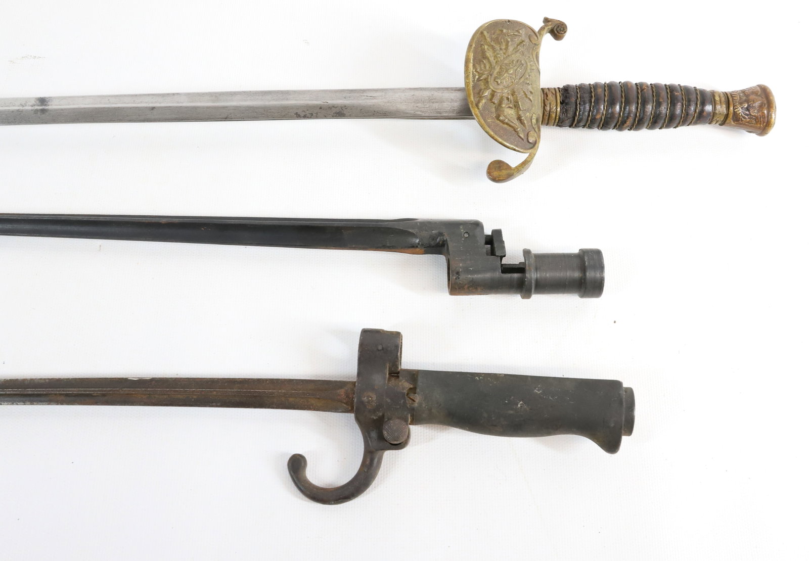 SWORD AND BAYONET LOT: INCLUDING: MOSIN NAGANT BAYONETS AND SWORD 33" TOTAL LENGTH. Registration: Terms:
