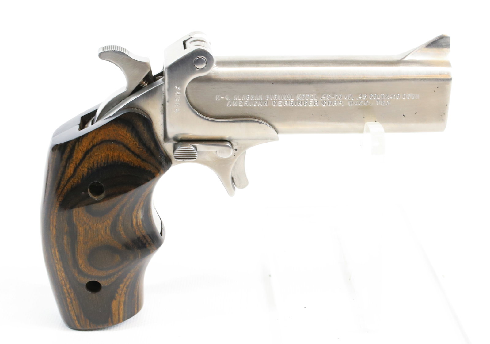 AMERICAN DERRINGER MODEL M-4 O/U: 45-70 CAL, SERIAL# 74388, 4" BARREL, STAINLESS Registration: Terms: THIS GUN REQUIRES REGISTRATION OR AN FFL TRANSFER TO PURCHASE