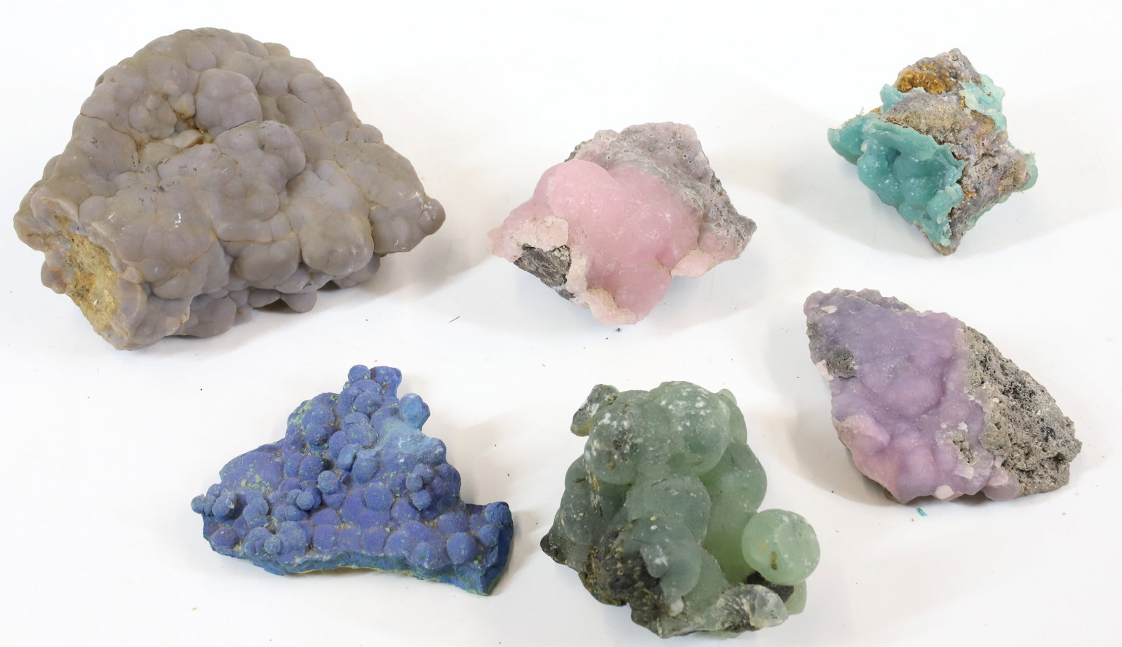 (6) SPECIMEN CLUSTERS: ARAGONITE, GRAPE AGATE AND MORE. LARGEST 2 1/4" X 4" X 4". Terms: PLEASE READ CAREFULLY -THIS IS AN ONLINE ONLY AUCTION WITH ABSENTEE AND PHONE BIDDING AS WELL. Terms for Purchasing and Shipping of Au