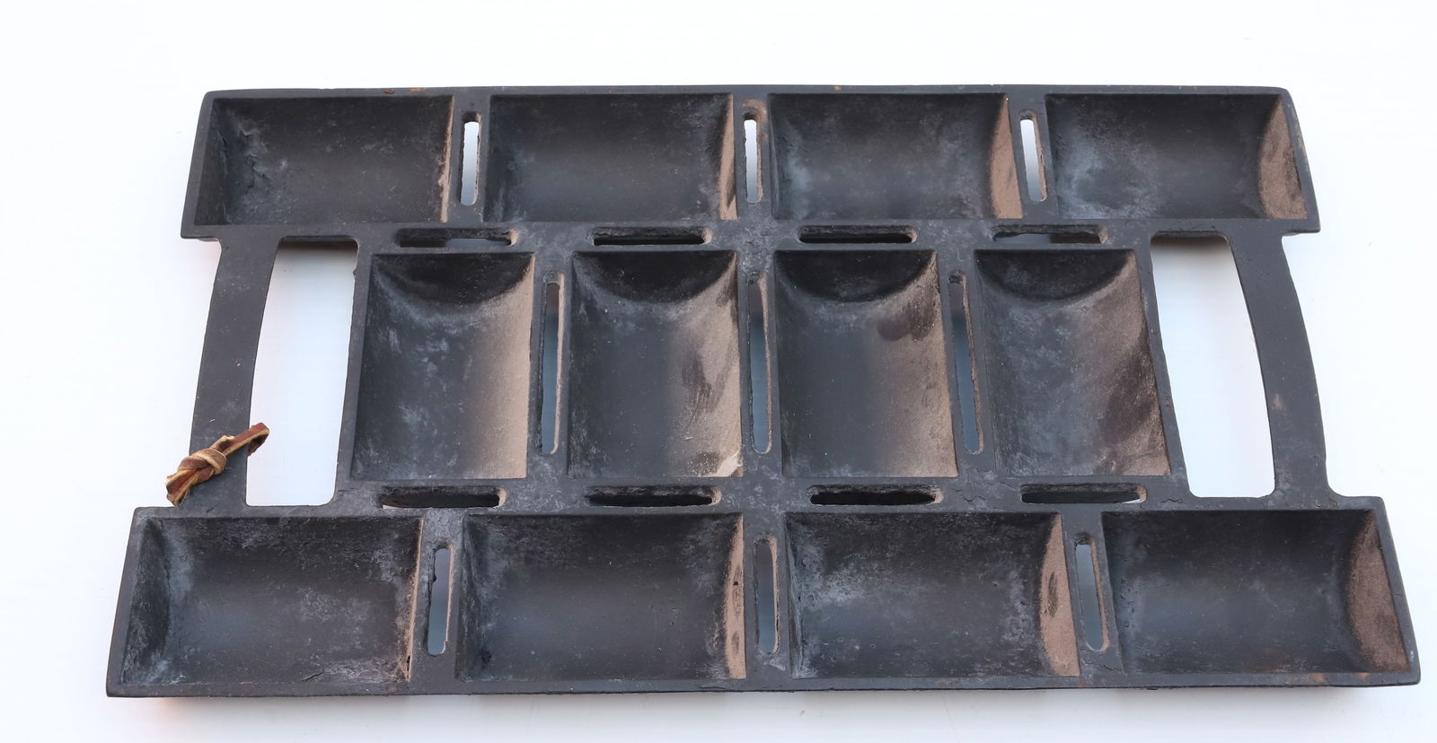 CAST IRON ROLL PAN: MARKED; FRENCH ROLL #11 WITH BLACK PAINTED SURFACE, 13" X 7 3/4" Terms: PLEASE READ CAREFULLY -THIS IS AN ONLINE ONLY AUCTION. Terms for Purchasing and Shipping of Auction Items. Please read carefully