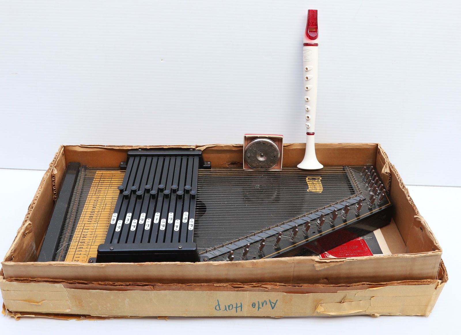 AUTOHARP IN ORIGINAL BOX: INCLUDES; INSTRUCTIONS - MADE BY; OSCAR SCHMIDT INTERNATIONAL Terms: PLEASE READ CAREFULLY -THIS IS AN ONLINE ONLY AUCTION. Terms for Purchasing and Shipping of Auction Items. Please read carefully be