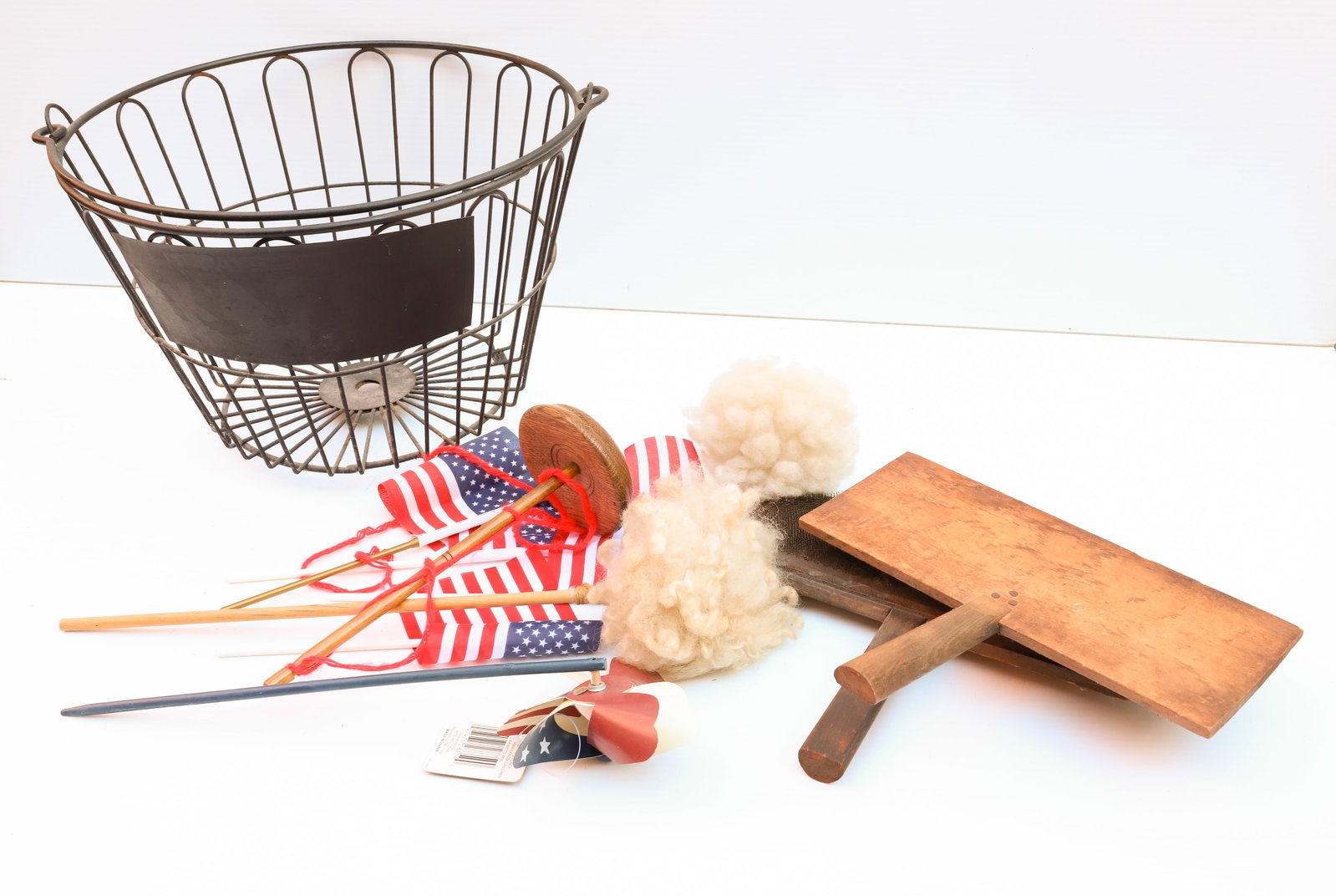 WIRE EGG BASKET: WITH WIRE COMBS, AMERICAN FLAGS, AND MORE - 9 1/2" X 14" BASKET Terms: PLEASE READ CAREFULLY -THIS IS AN ONLINE ONLY AUCTION. Terms for Purchasing and Shipping of Auction Items. Please read carefully 