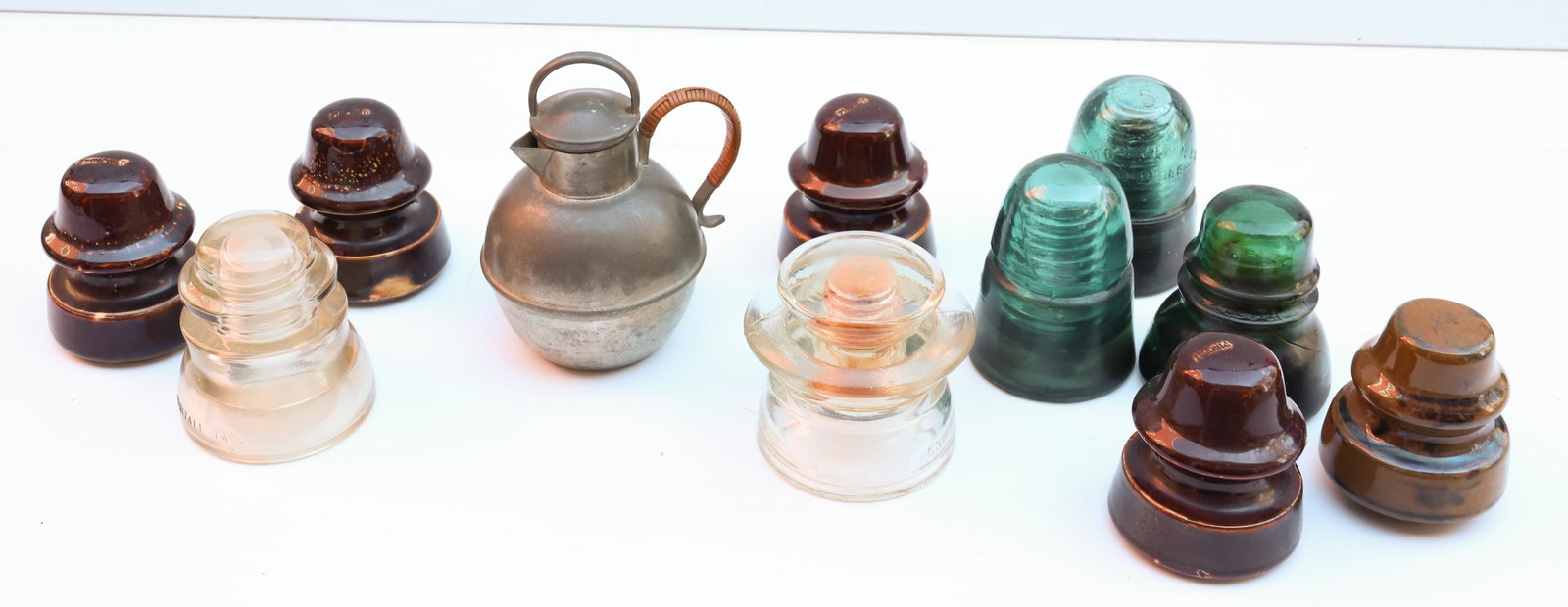 LOT OF GLASS INSULATORS: GLASS AND STONEWARE INSULATORS OF VARIOUS STYLES Terms: PLEASE READ CAREFULLY -THIS IS AN ONLINE ONLY AUCTION. Terms for Purchasing and Shipping of Auction Items. Please read carefully before bidding.