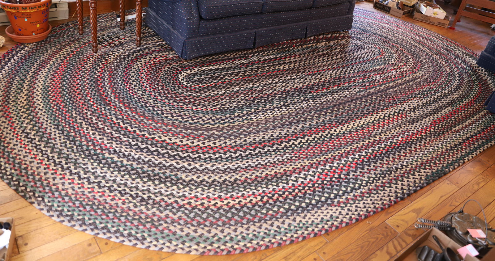 LARGE OVAL BRAIDED RUG (1 of 2)