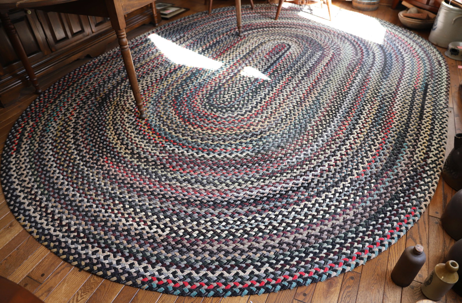 LARGE OVAL BRAIDED RUG (1 of 2)