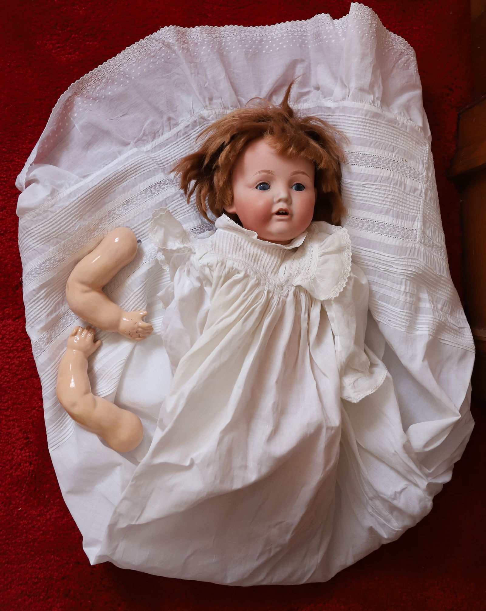 NIPPON BISQUE DOLL: MARKED; NIPPON RE, B8 - GLASS EYES, OPEN MOUTH WITH TEETH, JOINTED COMPOSITION BODY, (ARMS ARE PRESENT BUT DETACHED) 18" L - IN EARLY CHRISTENING DRESS Terms: PLEASE READ CAREFULLY -THIS IS AN ONLINE