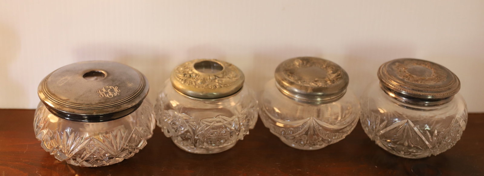 CUT GLASS HAIR RECEIVER AND POWDERS JARS: (4) WITH SILVER PLATED LIDS Terms: PLEASE READ CAREFULLY -THIS IS AN ONLINE ONLY AUCTION. Terms for Purchasing and Shipping of Auction Items. Please read carefully before bidding. All payments for pur