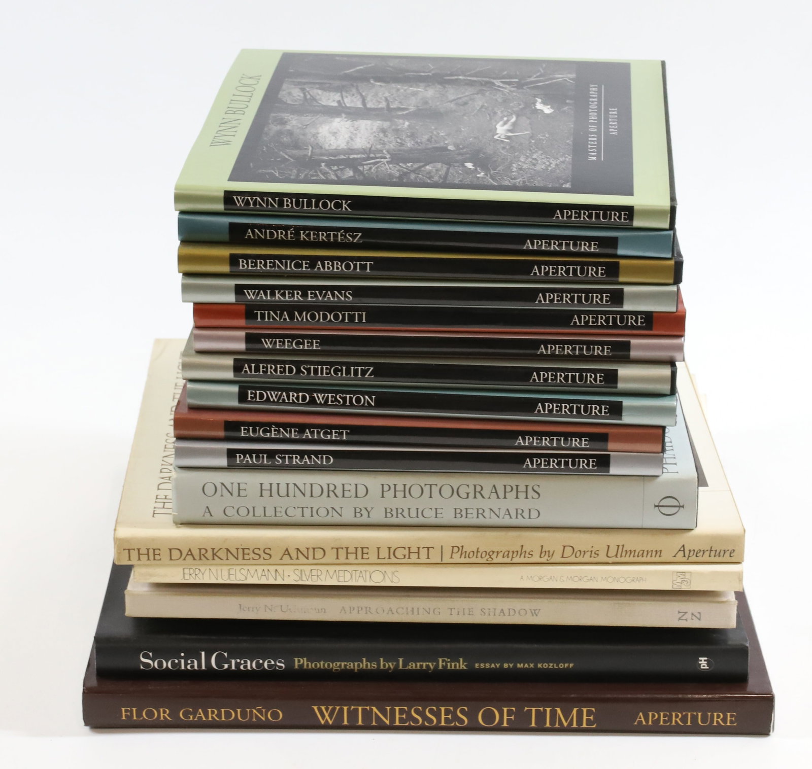 LOT OF ART PHOTOGRAPHY COFFEE TABLE BOOKS: (18) INCLUDING: SERIES OF (10) APERTURE PHOTOGRAPHER BOOKS. ONE HUNDRED PHOTOGRAPHS, BRUCE BERNARD, 2000. THE HARLEM BOOK OF THE DEAD, 1978. APPROACHING THE SHADOW, UELSMANN. JERRY N. UELSMANN, 1970. 