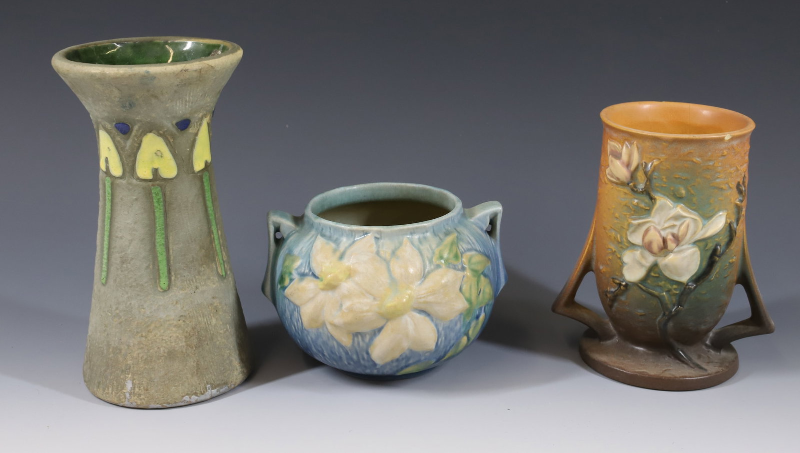 (3) ROSEVILLE: MOSTIQUE VASE 8"H, MAGNOLIA VASE 4 1/4" AND MAGNOLIA 6 1/4" PLEASE READ CAREFULLY -THIS IS AN ONLINE ONLY AUCTION. WE WILL BE TAKING ABSENTEE AND PHONE BIDS ALSO. Terms for Purchasing and Shipping of 