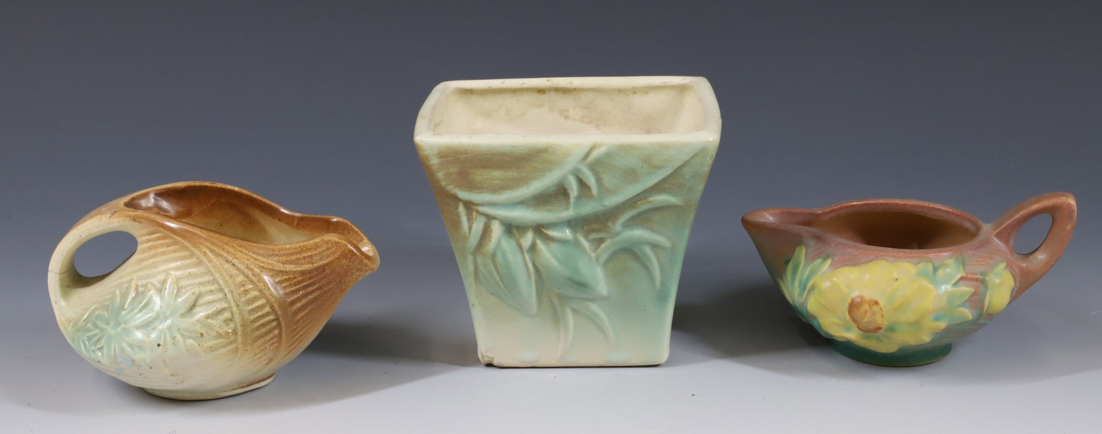 (3) MCCOY AND ROSEVILLE: ROSEVILLE CREAMER AND MCCOY CREAMER AND SQUARE POT 2 3/4"H TO 4"H PLEASE READ CAREFULLY -THIS IS AN ONLINE ONLY AUCTION. WE WILL BE TAKING ABSENTEE AND PHONE BIDS ALSO. Terms for Purchasing and Shippi