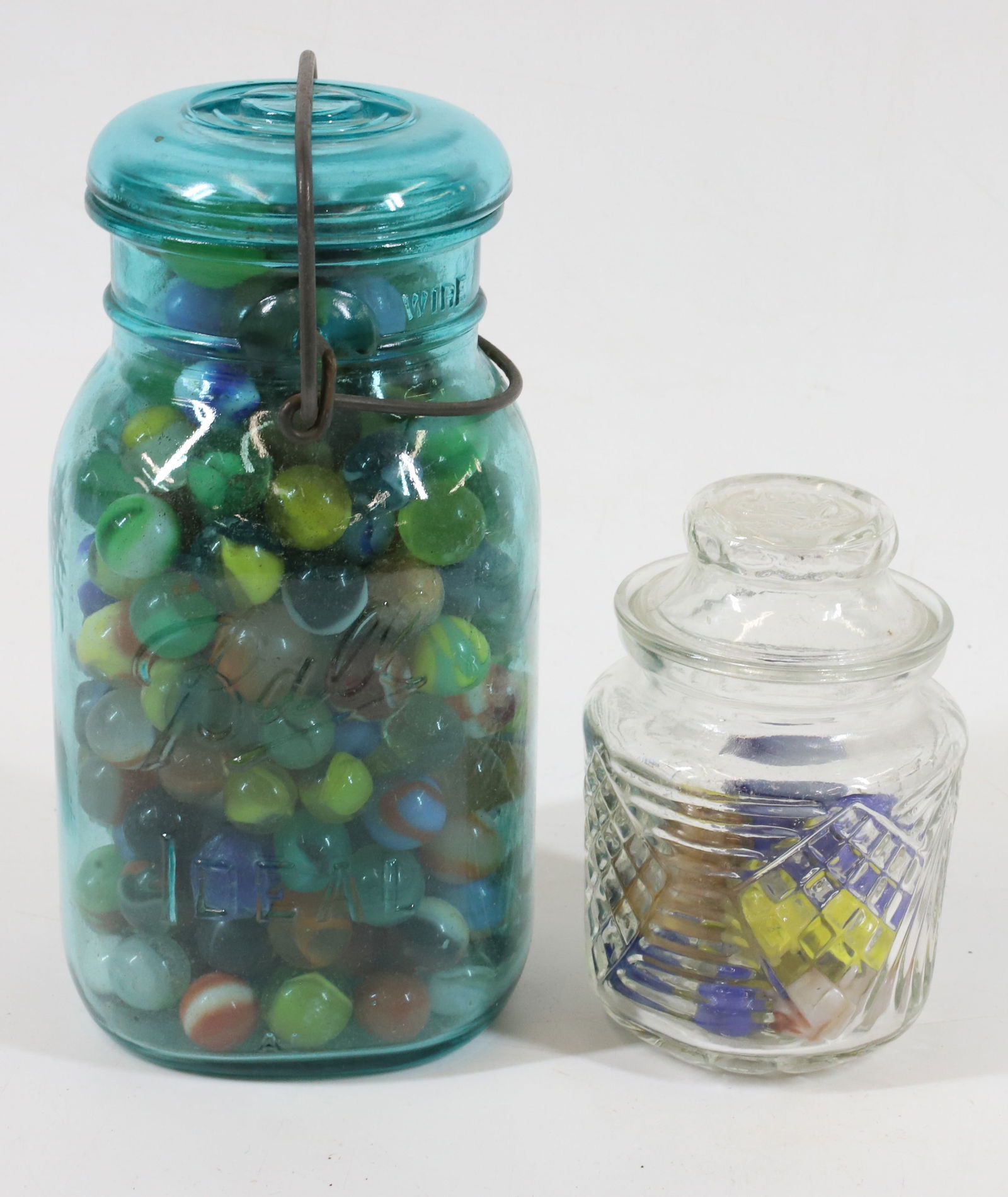 (2) JARS OF GLASS MARBLES: VARIOUS SIZES AND COLORS. PLEASE READ CAREFULLY -THIS IS AN ONLINE ONLY AUCTION. WE WILL BE TAKING ABSENTEE AND PHONE BIDS ALSO. Terms for Purchasing and Shipping of Auction Items. Please read careful