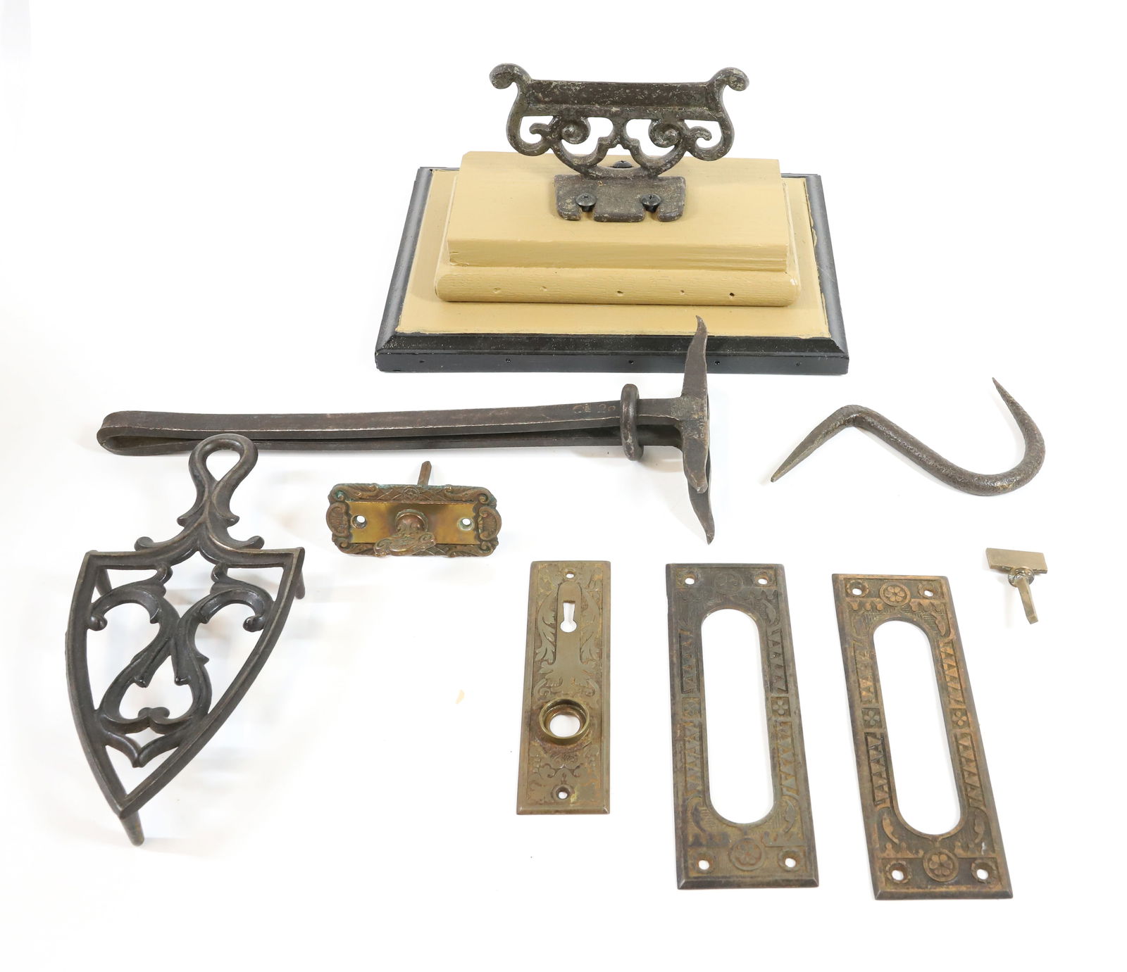 LOT OF CAST IRON AND BRASS: INCLUDING: BOOT SCRAPER, TRIVET, HOOK, DOOR HARDWARE AND MORE. PLEASE READ CAREFULLY -THIS IS AN ONLINE ONLY AUCTION. WE WILL BE TAKING ABSENTEE AND PHONE BIDS ALSO. Terms for Purchasing and Shipping