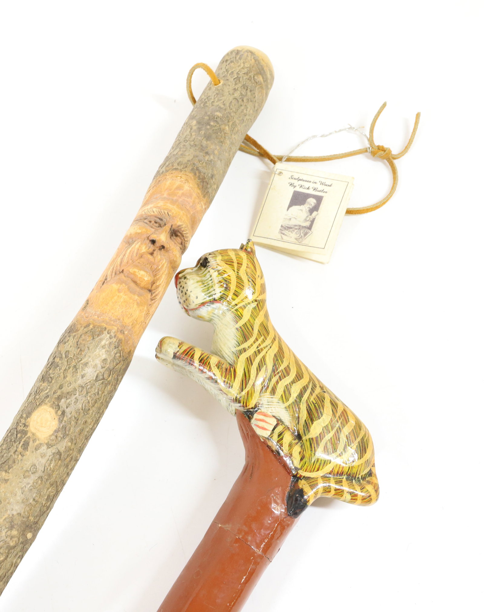 RICK BUTLER WALKING STICK WITH TIGER STICK: CARVED FACE ON STICK SGND/DATED 1998, 58" L. PAINTED/CARVED TIGER WALKING STICK, UNSIGNED, 38" L. PLEASE READ CAREFULLY -THIS IS AN ONLINE ONLY AUCTION. WE WILL BE TAKING ABSENTEE AND PHONE BIDS ALSO.