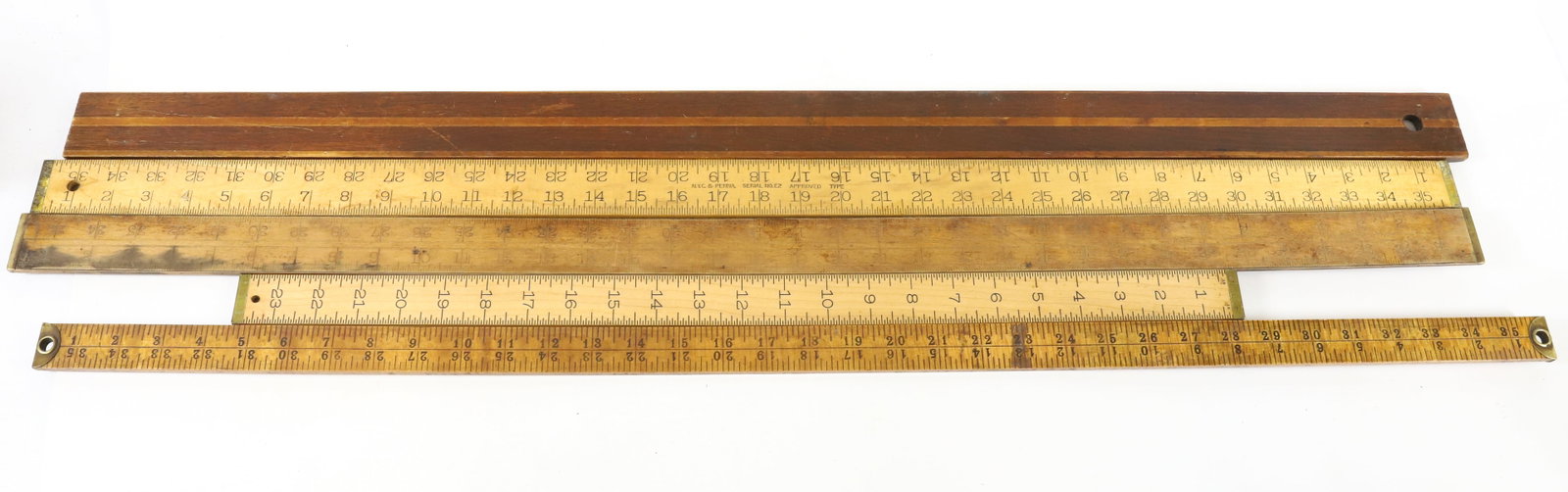 LOT OF BRASS EDGE MEASURING STICKS: (5) INCLUDING: LUFKIN, ARROW BRAND, LUFKIN NO. 7132 AND MORE. PLEASE READ CAREFULLY -THIS IS AN ONLINE ONLY AUCTION. WE WILL BE TAKING ABSENTEE AND PHONE BIDS ALSO. Terms for Purchasing and Shipping o