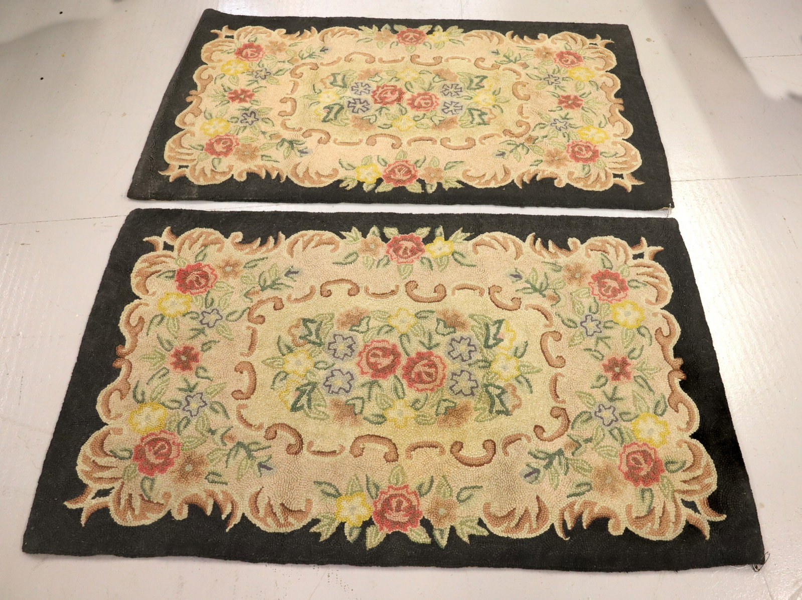 PAIR OF VINTAGE HOOKED RUGS: FLORAL PATTERNS WITH BLACK BORDERS. 35" X 60". PLEASE READ CAREFULLY -THIS IS AN ONLINE ONLY AUCTION. WE WILL BE TAKING ABSENTEE AND PHONE BIDS ALSO. Terms for Purchasing and Shipping of Auction Items