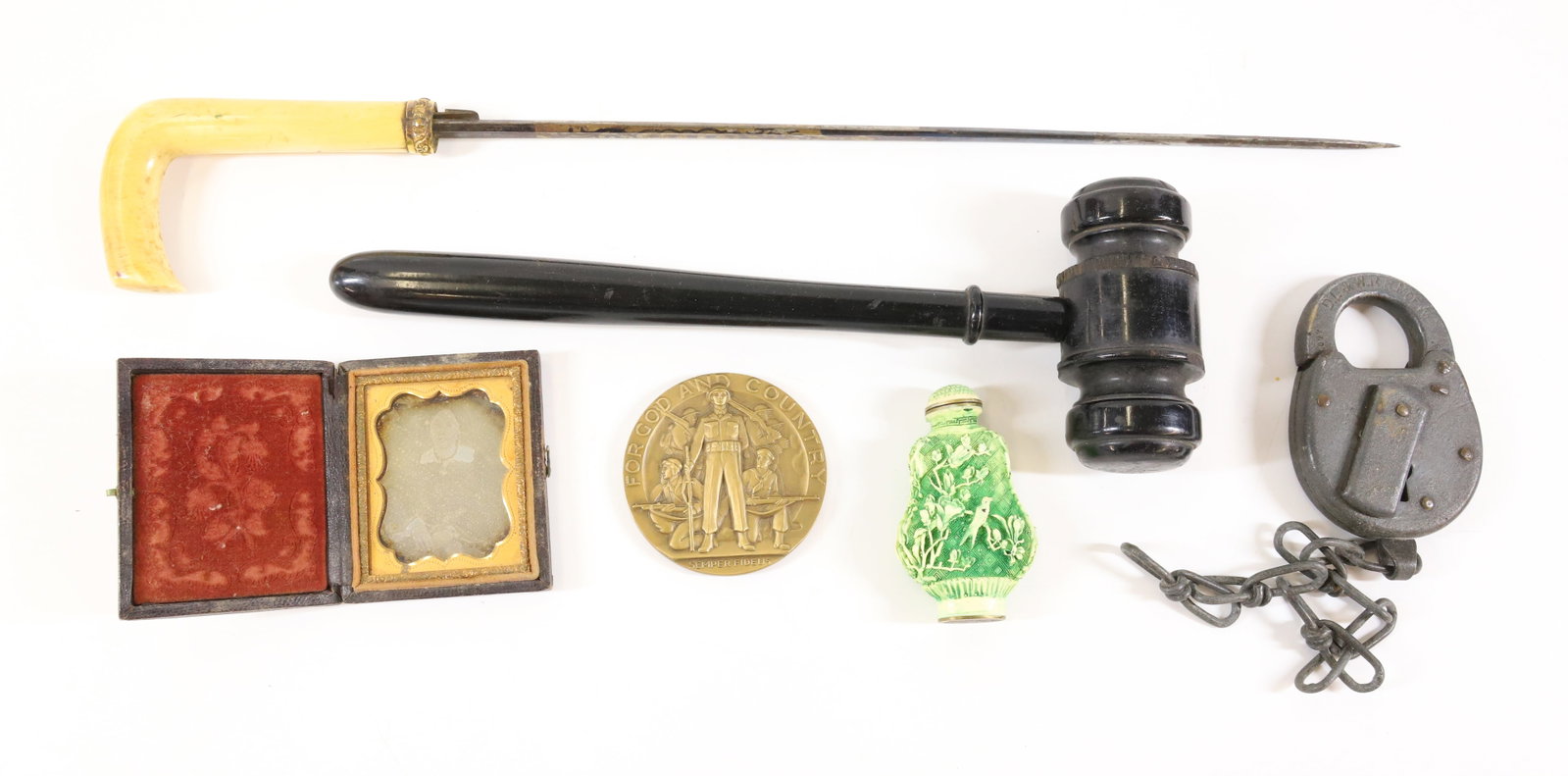 LOT OF VINTAGE SMALLS: INCLUDING: BRONZE AMERICAN LEGION AWARD 2 1/2" D., D.L. & W. RAILROAD LOCK, GAVEL, DAGUERREOTYPE OF A WOMAN 2 1/2" X 2", ETCHED BLADE WITH BONE HANDLE (BLADE 13" L.) AND SNUFF BOTTLE. PLEASE READ CARE