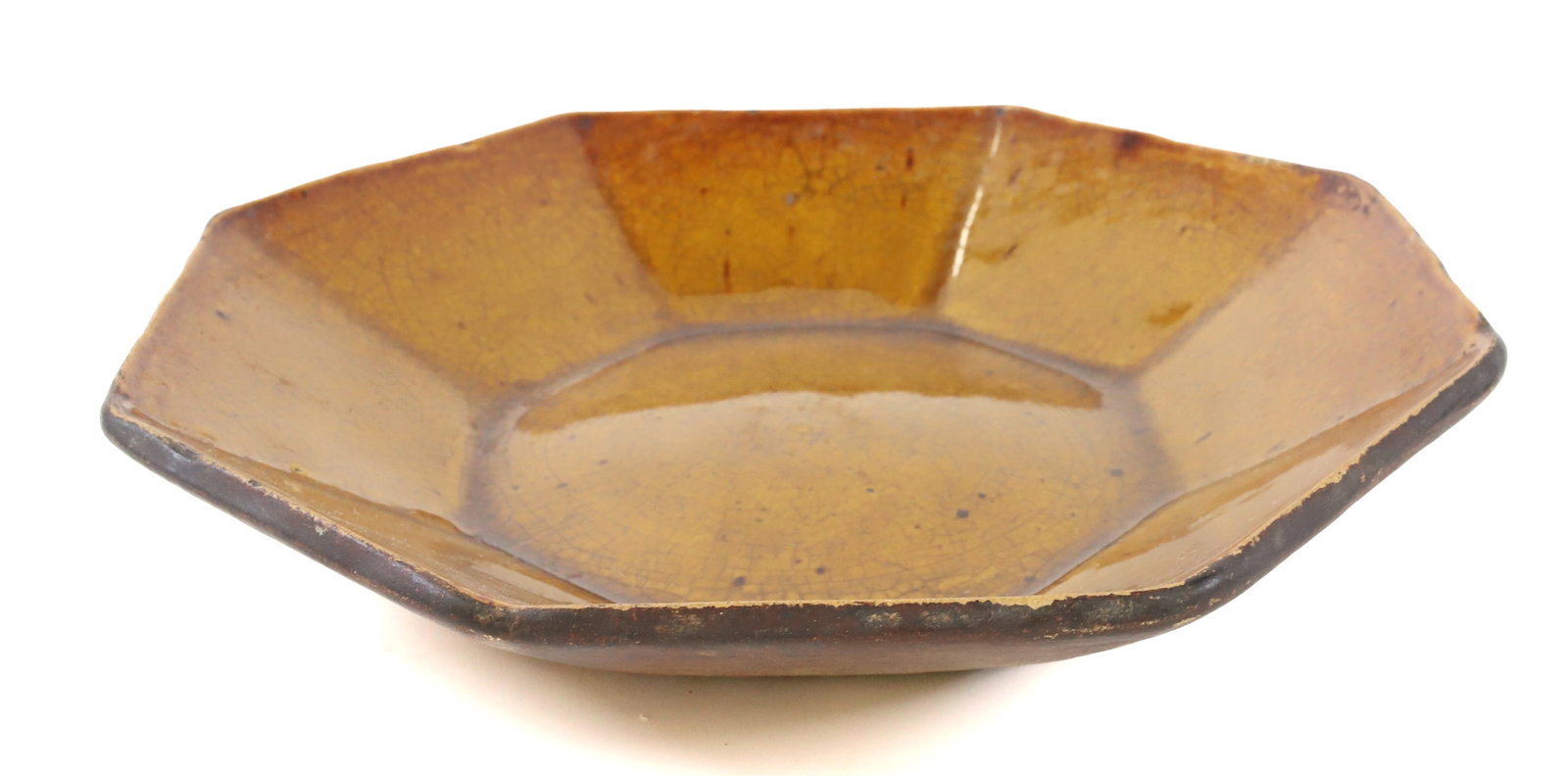 OCTAGONAL POTTERY ADVERTISING PLATE: BROWN GLAZE. INCISED ON BOTTOM "HARRY B. MOORE ICE CREAM, TOBACCO, CIGARS, CHOICE CANDIES, OYSTERS, GUNS, AMMUNITION, ETC." 9 3/4" D. PLEASE READ CAREFULLY - Terms for Purchasing and Shipping of Aucti