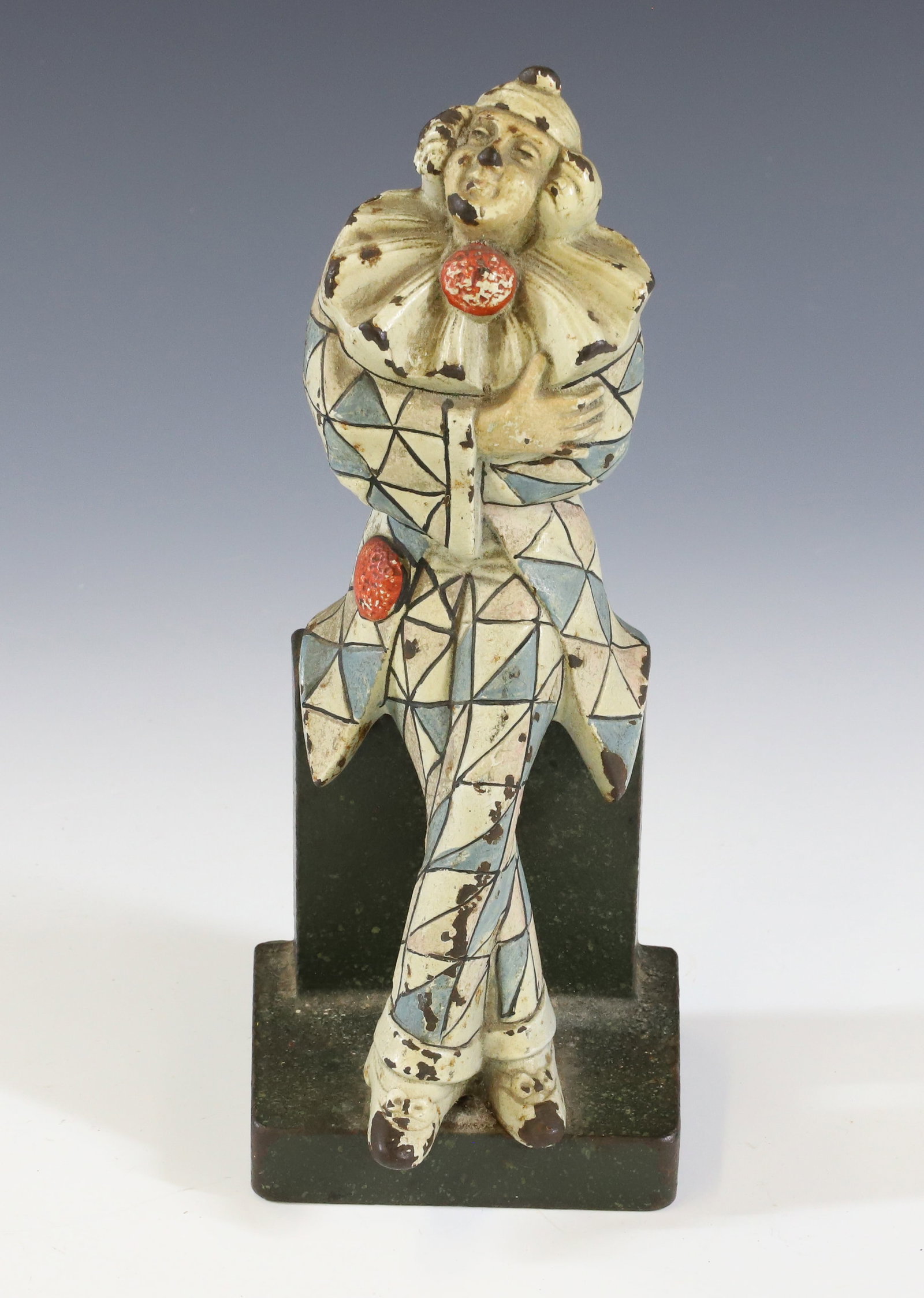 CAST IRON HARLEQUIN DOORSTOP: MRKD. ON BACK. NO. 1281 BY JUDD COMPANY. 7 7/8" H. PLEASE READ CAREFULLY - Terms for Purchasing and Shipping of Auction Items. Please read carefully before bidding. All payments for purchases will be 
