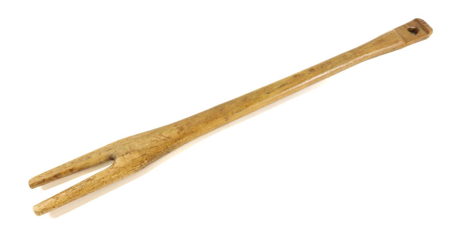 FOLK ART CARVED LAUNDRY STICK: TWO-PRONG STICK WITH HEART CUT-OUT HANDLE. 32" L. PLEASE READ CAREFULLY - Terms for Purchasing and Shipping of Auction Items. Please read carefully before bidding. All payments for purchases will be m