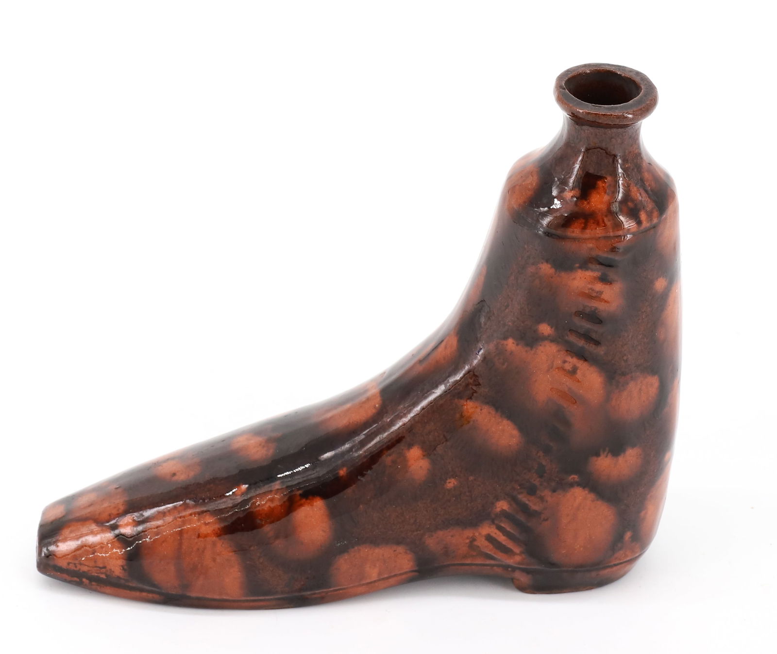 REDWARE SHOE FLASK: ORANGE GLAZE WITH BROWN DECORATION. INCISED "NAILS" ON BOTTOM. 6" X 7". NICE DECORATION/COLOR. PLEASE READ CAREFULLY - Terms for Purchasing and Shipping of Auction Items. Please read carefully before