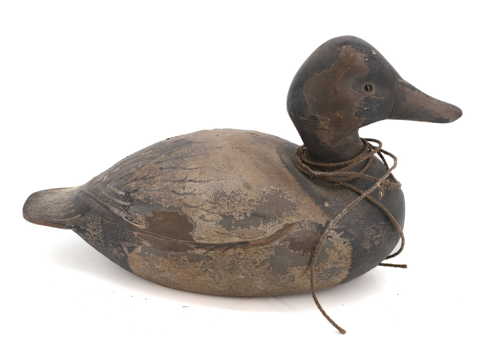 CARVED AND PAINTED DUCK DECOY: PAINTED SURFACE WITH GLASS EYES. INITIALED G.D.R. 12 1/2" L. PLEASE READ CAREFULLY - Terms for Purchasing and Shipping of Auction Items. Please read carefully before bidding. All payments for purchase