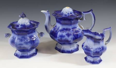 (3) FLOW BLUE TONQUIN TEAPOT,SUGAR BOWL AND CREAMER