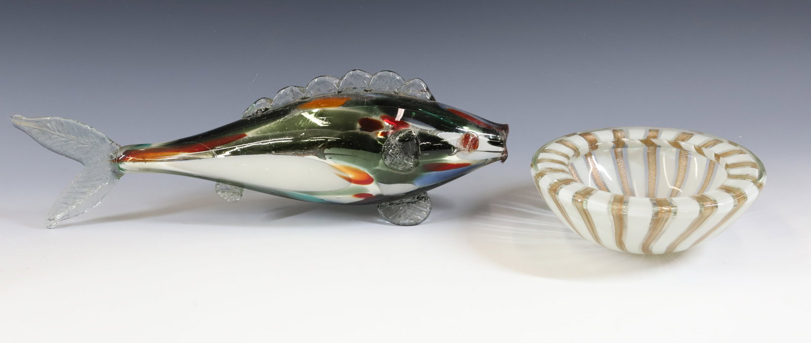 (2) MURANO GLASS: BOWL WITH WHITE AND GOLDSTONE RIBBONS, FISH MULTICOLORED BOTH HAND BLOWN 3" X 7 1/4", 5 1/4" X 17" PLEASE READ CAREFULLY - Terms for Purchasing and Shipping of Auction Items. Please read carefully bef