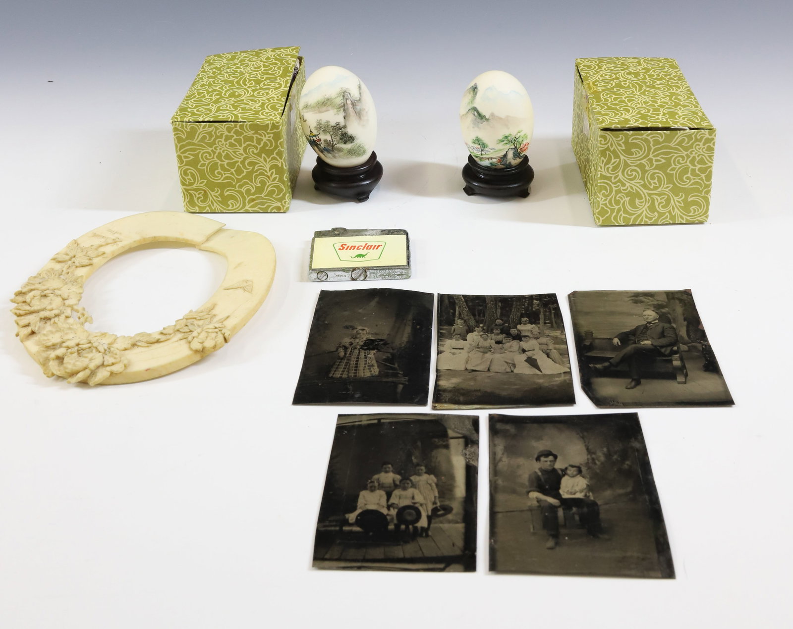 (9) MISCELLANEOUS GROUP: INCLUDES TWO REAL EGGS WITH MINIATURE JAPANESE PAINTINGS AND STANDS IN ORIGINAL BOXES, CARVED BONE PHOTO FRAME (DAMAGE), SINCLAIR LIGHTER AND FIVE TINTYPES FROM NEW YORK WITH INFO 4" X 2 1/2", 5 1/2"