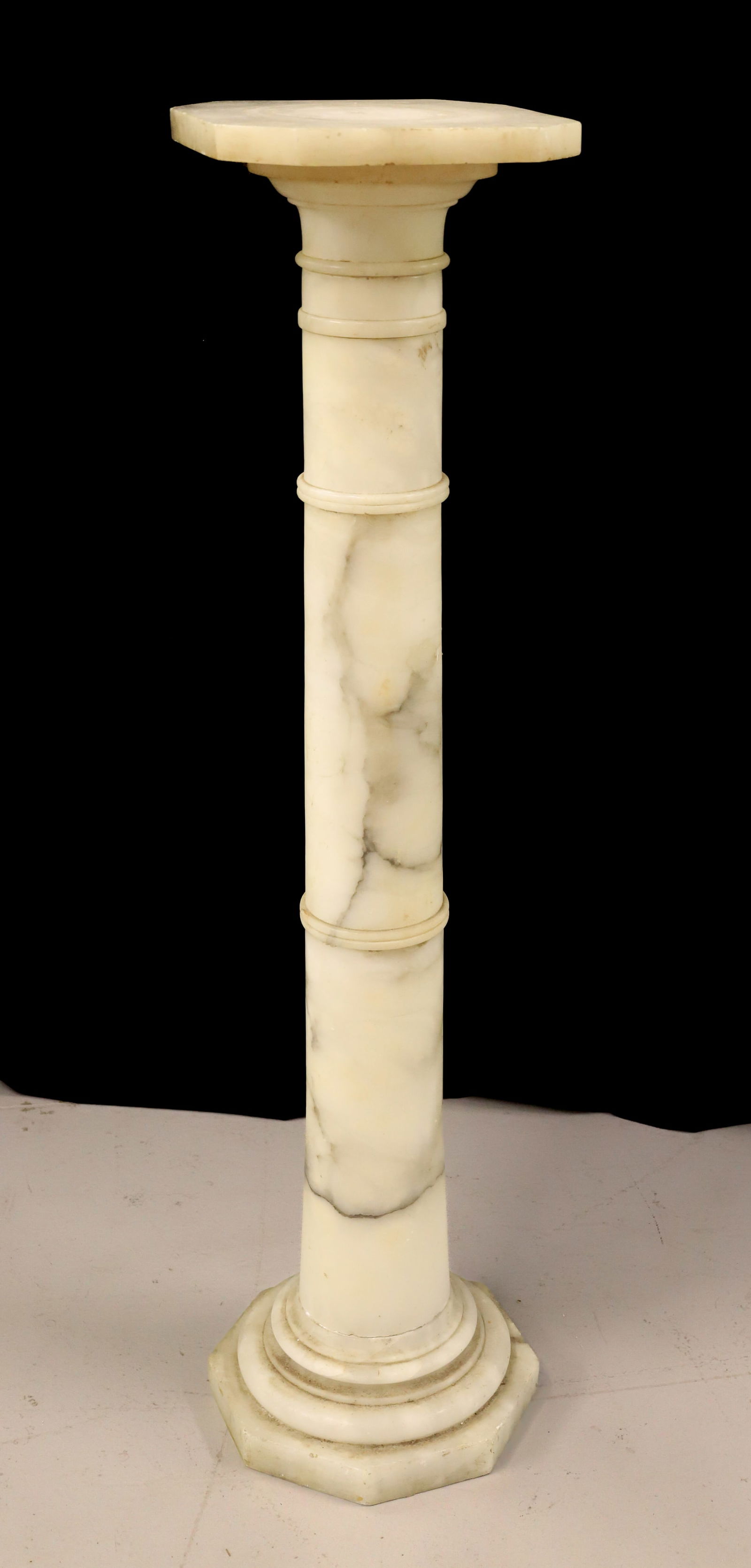 ALABASTER PEDESTAL: MOTTLED WHITE WITH BLACK, 37 1/4"H X 8 3/4" X 8 3/4" PLEASE READ CAREFULLY - Terms for Purchasing and Shipping of Auction Items. Please read carefully before bidding. All payments for purchases will b