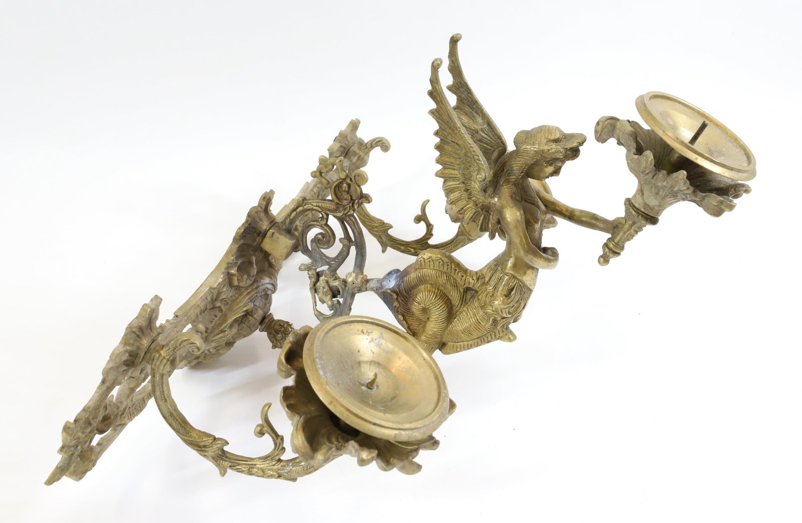 ROCOCO WALL SCONCE: BRASS THREE LIGHT SCONCE, WINGED SPHINX HOLDING CENTER LIGHT 18"H X 19" PLEASE READ CAREFULLY - Terms for Purchasing and Shipping of Auction Items. Please read carefully before bidding. All payments f