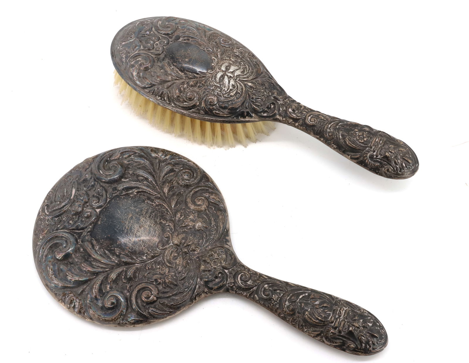 (2) STERLING SILVER BRUSH/MIRROR: ENGLISH WITH HALLMARKS HAND CHASED WITH FLOWERS, DOVE AND OLD MAN NORTH 9 3/8"L TOTAL WEIGHT 15.3 OZT BOTH WEIGHTED WITH CEMENT PLEASE READ CAREFULLY - Terms for Purchasing and Shipping of Auction Ite