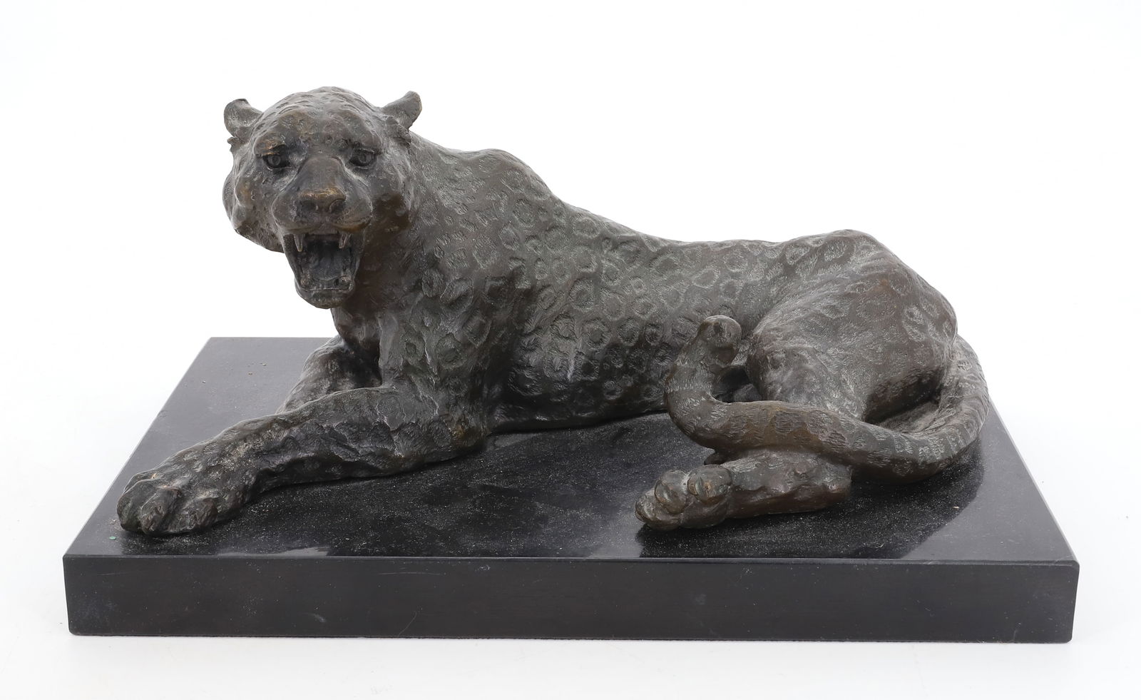 BRONZE LEOPARD: RECLINING LEOPARD WITH OPEN MOUTH. BLACK SLATE BASE. UNSIGNED. 7" H. X 12 1/2" X 8 1/2".