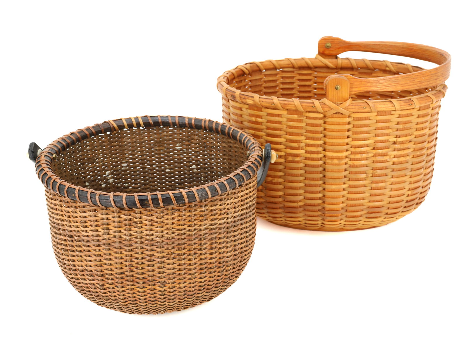 (2) NANTUCKET BASKETS: ROUND BASKET WITH DROP HANDLE, AND STAINED BLACK WOOD (UNMARKED) 5 3/4" X 8 1/4" AND OVAL WOVEN BASKET, MARKED; A.R.M. HANDCRAFT BASKET 6 1/2" X 10 1/4" PLEASE READ CAREFULLY - Terms for Purchasing an