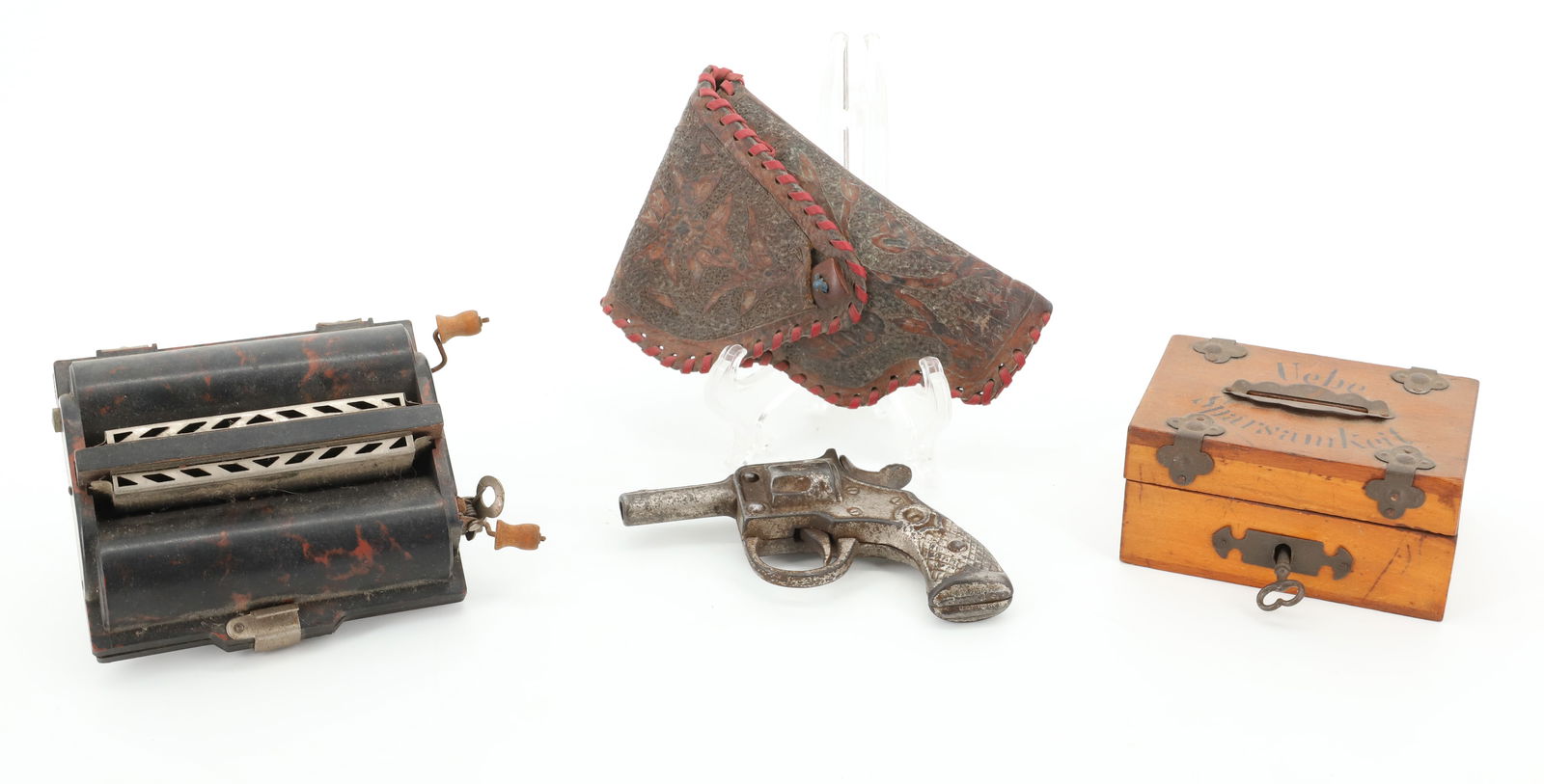 LOT OF ANTIQUE SMALLS: INCLUDING; ROLMONICA, PATENT 1928 - SMALL GERMAN LOCK BOX ( 3 1/2"), AND CAP GUN WITH HOLSTER (4") UNMARKED PLEASE READ CAREFULLY - Terms for Purchasing and Shipping of Auction Items. Please read care