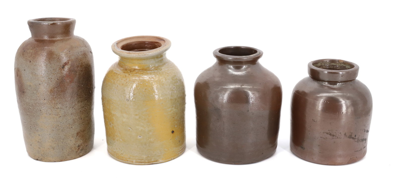 (4) STONEWARE JARS: BROWN AND YELLOWISH GLAZES. 5 1/4" TO 8" HEIGHTS. PLEASE READ CAREFULLY - Terms for Purchasing and Shipping of Auction Items. Please read carefully before bidding. All payments for purchases will be m