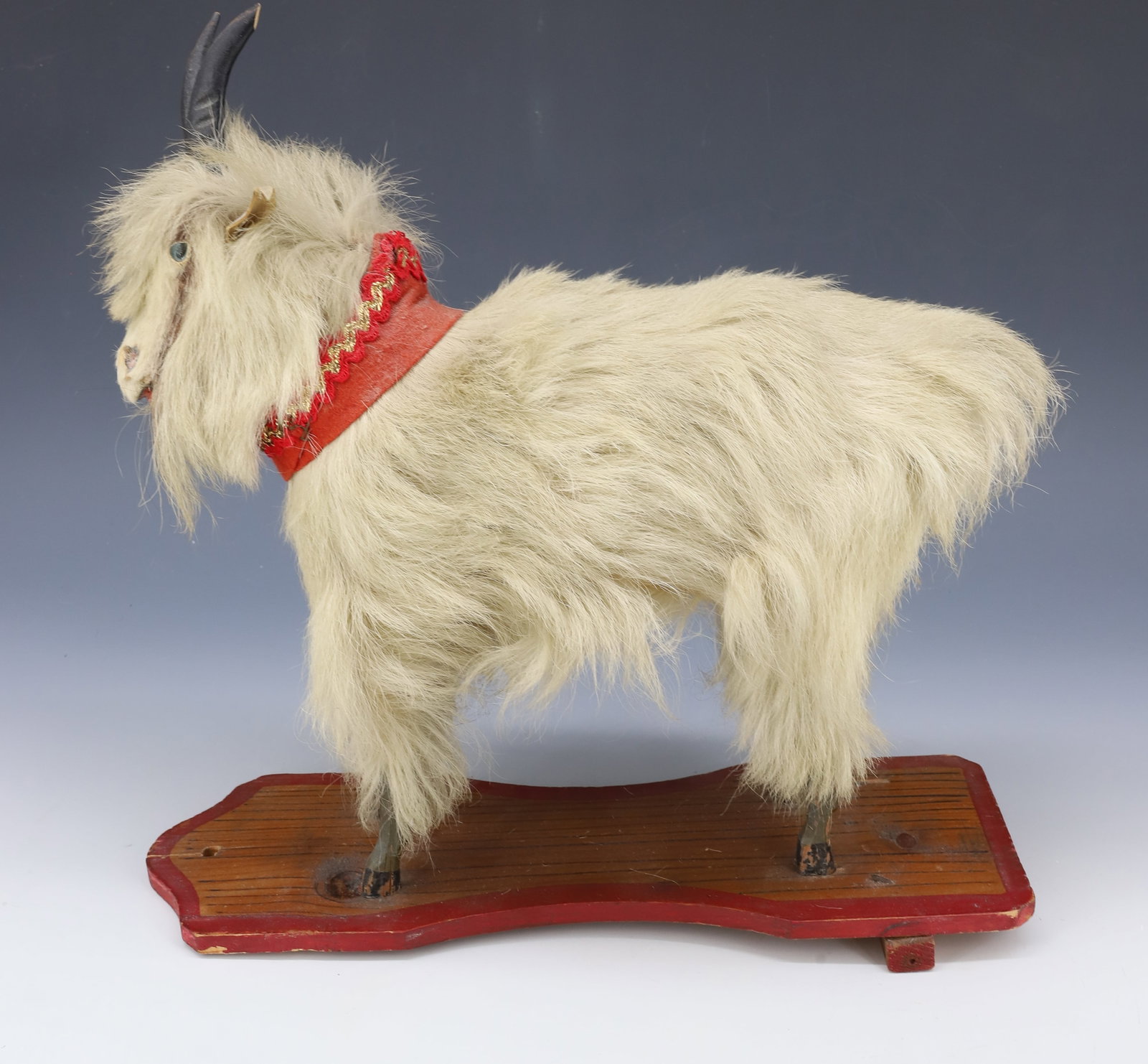 BILLY GOAT PULL TOY: HAIRY GOAT ON WOODEN PLATFORM. 12" X 12". PLEASE READ CAREFULLY - Terms for Purchasing and Shipping of Auction Items. Please read carefully before bidding. All payments for purchases will be made thro