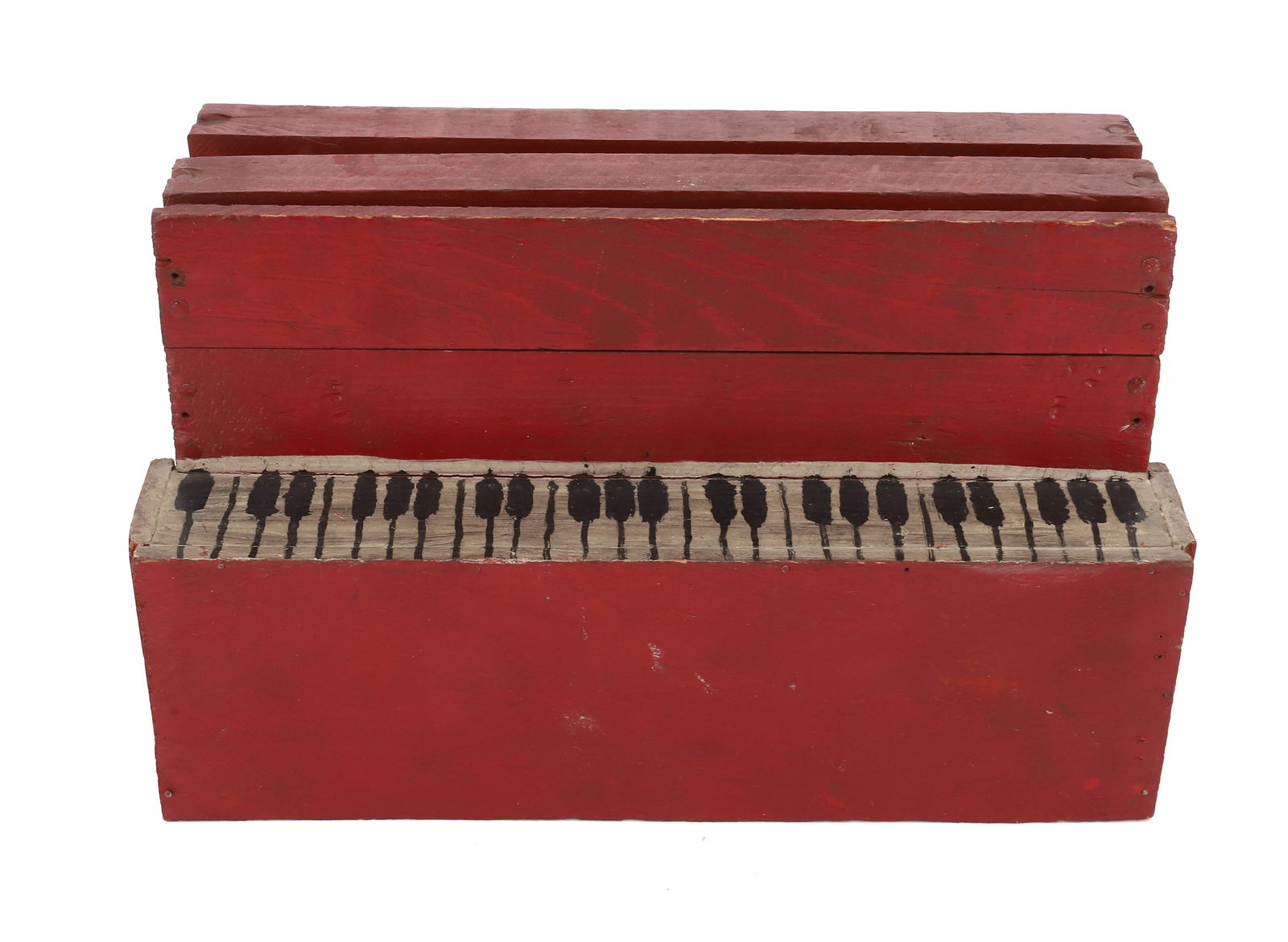 FOLK ART WOODEN PIANO: MADE FROM ADVERTISING CRATES. PAINTED RED WITH BLACK/WHITE KEYS. 5 1/2" X 9 1/4" X 4". PLEASE READ CAREFULLY - Terms for Purchasing and Shipping of Auction Items. Please read carefully before bidding.