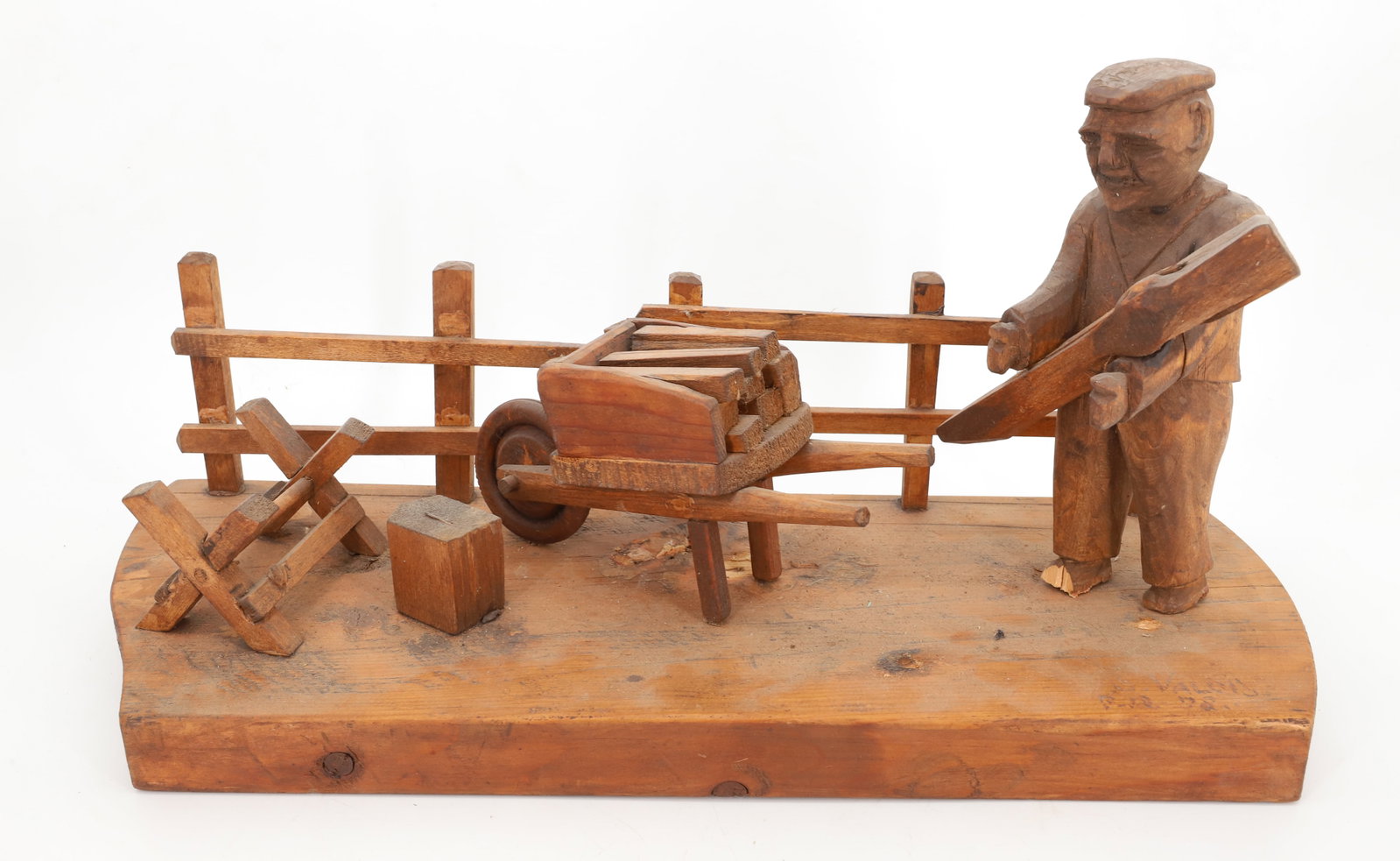 FOLK ART CARVED VIGNETTE: MAN CUTTING WOOD. FENCE ON BACK WHEEL BARROW AND MORE. SGND/DATED "78". 18 1/2" L. PLEASE READ CAREFULLY - Terms for Purchasing and Shipping of Auction Items. Please read carefully before bidding. All